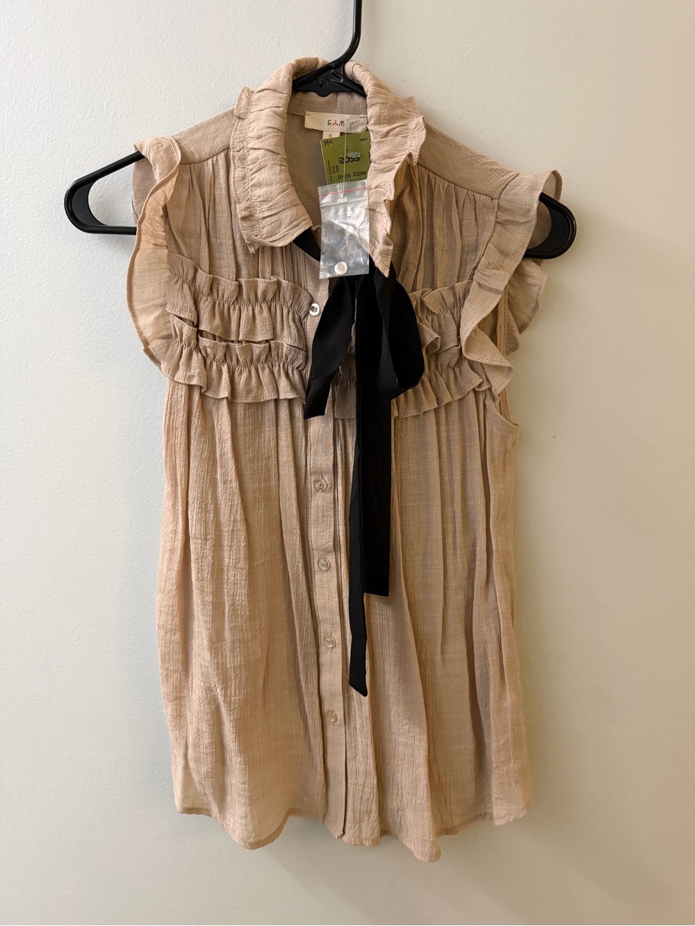 Ruffled Sleeveless Tie-Neck Blouse in Beige with Black Bow